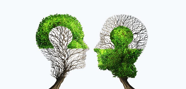 Perfect business partnership as a connecting puzzle shaped as two trees in the form of human heads connecting together to complete each other as a corporate success metaphor for cooperation and agreement as equal partners.